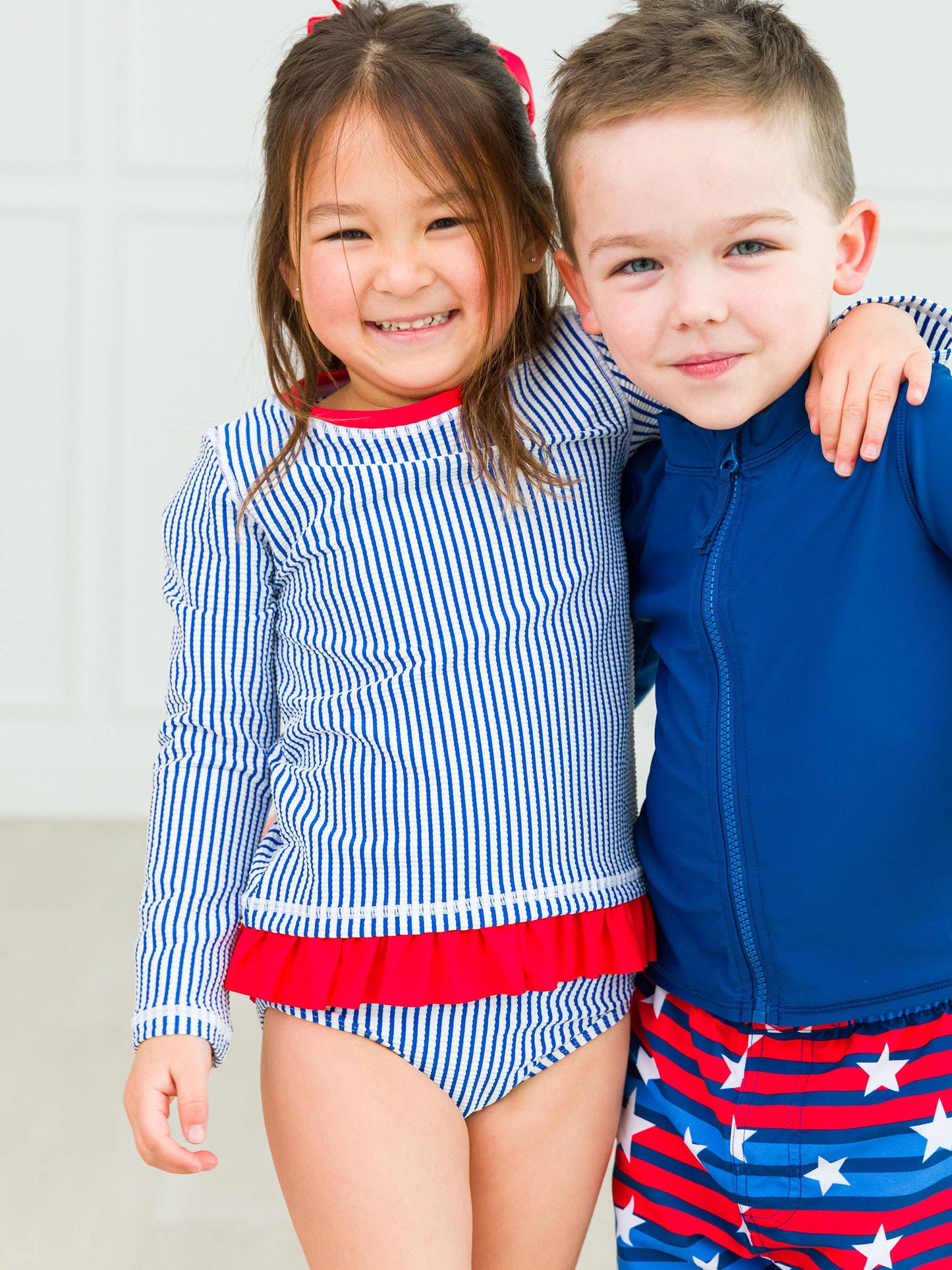 Girls Blue Seersucker Long Sleeve Rash Guard 2-Piece Swimsuit with Signature Rear Ruffles