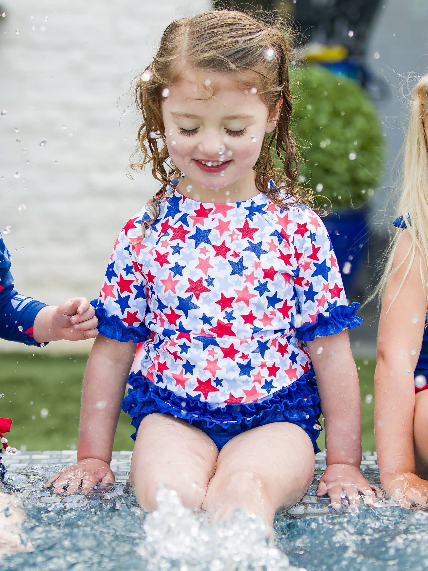 Girls Shimmer Star-Spangled Classic Short Sleeve Rash Guard 2-Piece Swimsuit with Signature Rear Ruffles