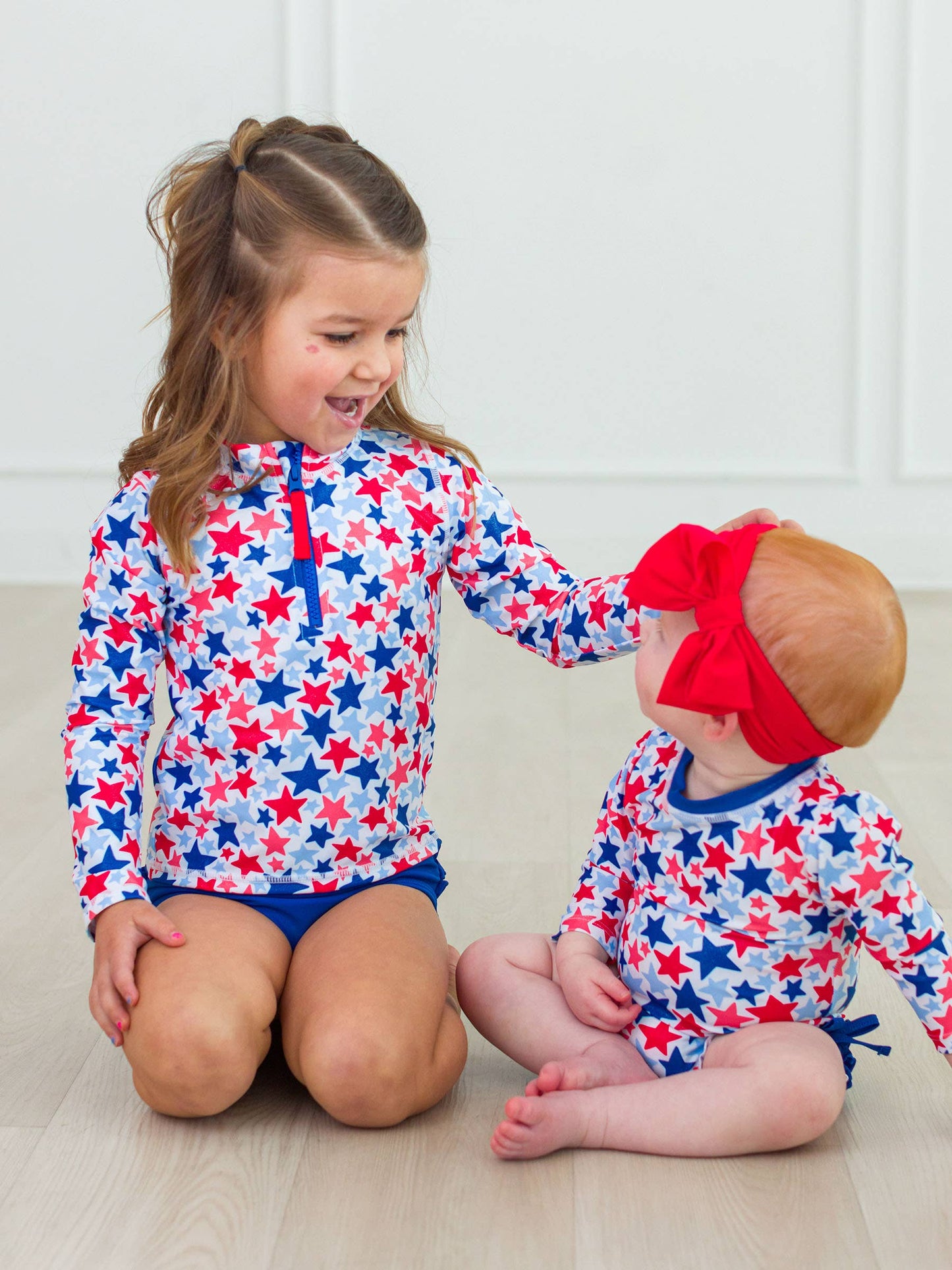 Girls Shimmer Star-Spangled Long Sleeve Zipper Rash Guard 2-Piece Swimsuit with Signature Rear Ruffles